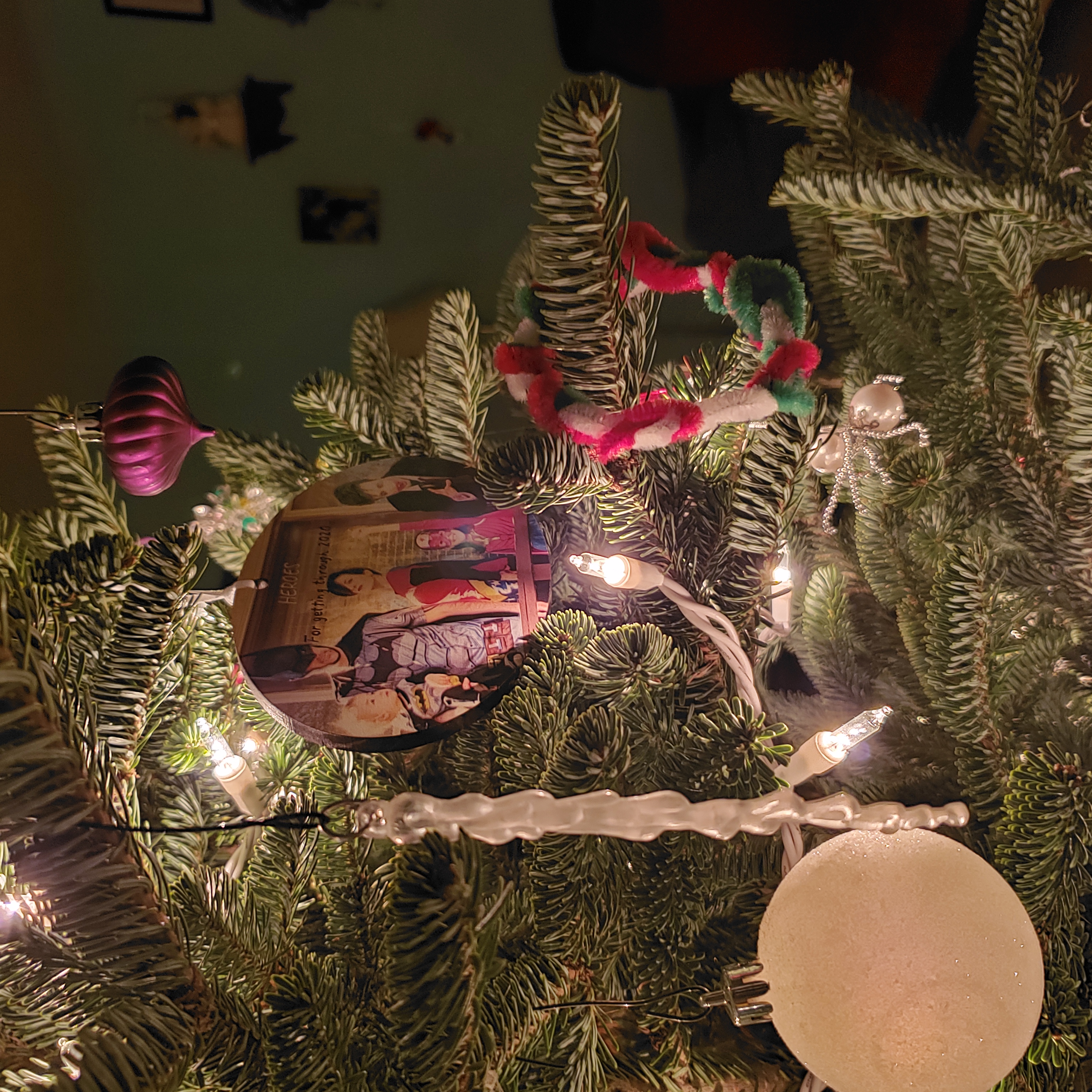 A picture of a Christmas tree and its decorations up close.