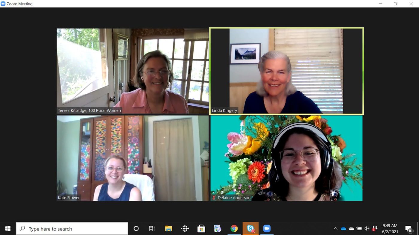 A picture of four women smiling on zoom.